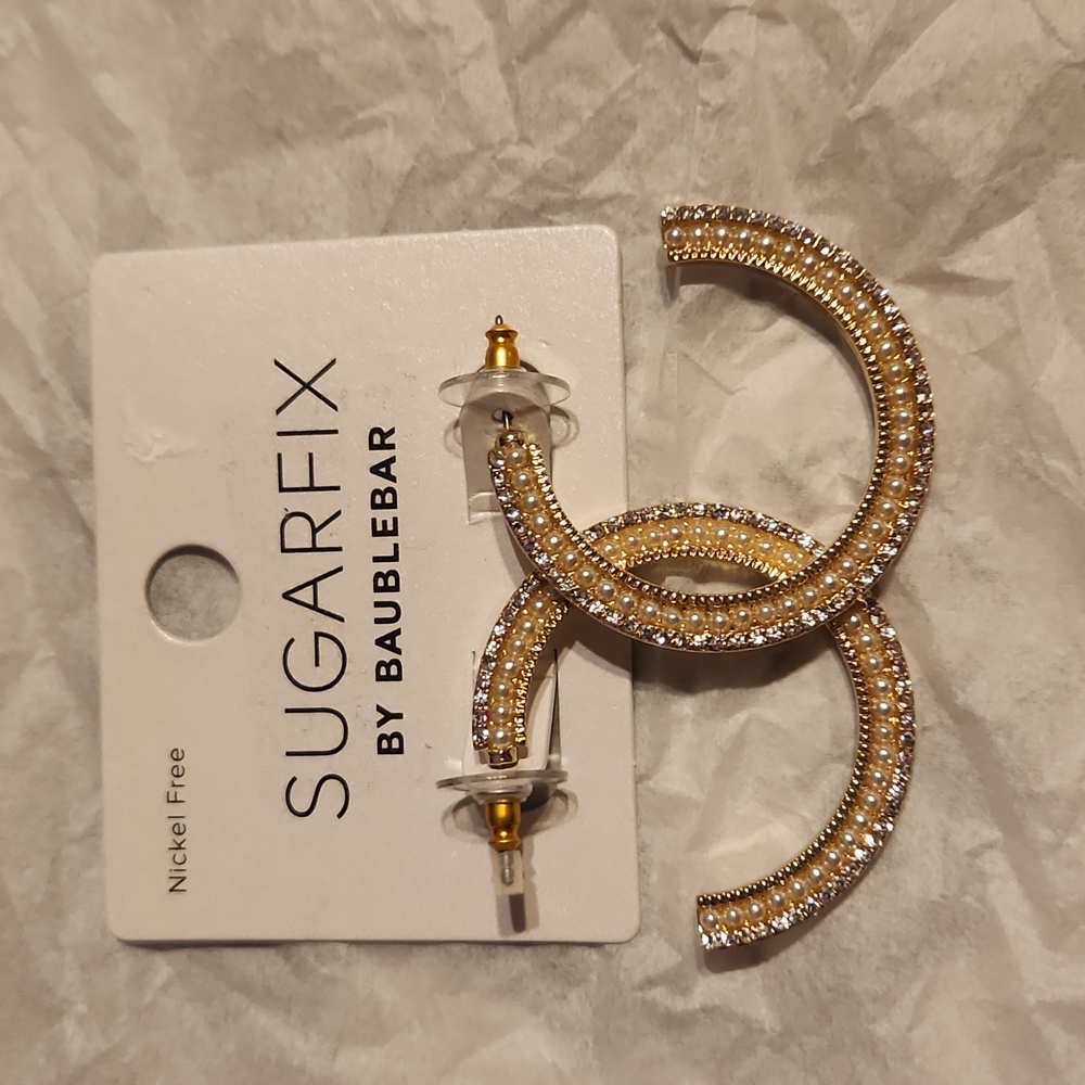 Brand new never worn SUHARFIX earrings. Gold with crystals.